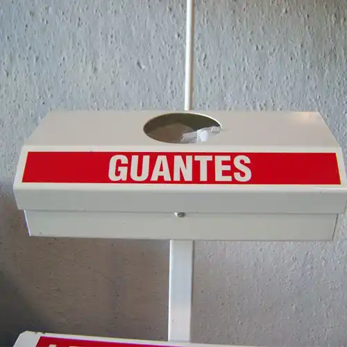 Dispensador de guantes con papelera basculante